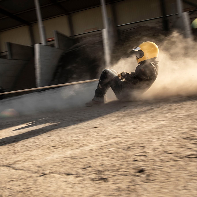 Guy being dragged wearing motorcycle jeans